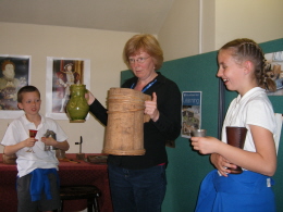 A guide shows off a pair of artefacts.
